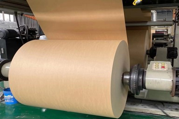 A perfectly wound, large prime roll of virgin kraft paper